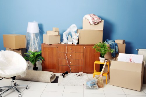 Charity donation boxes and reusable furniture prepared during a move