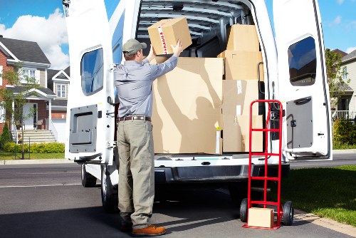 Packed moving boxes and household items prepared for truck hire