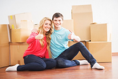 Packed office equipment and furniture ready for local relocation