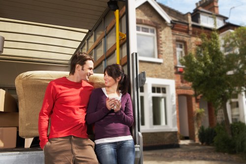 Removal specialists handling household items with care during a Croydon move